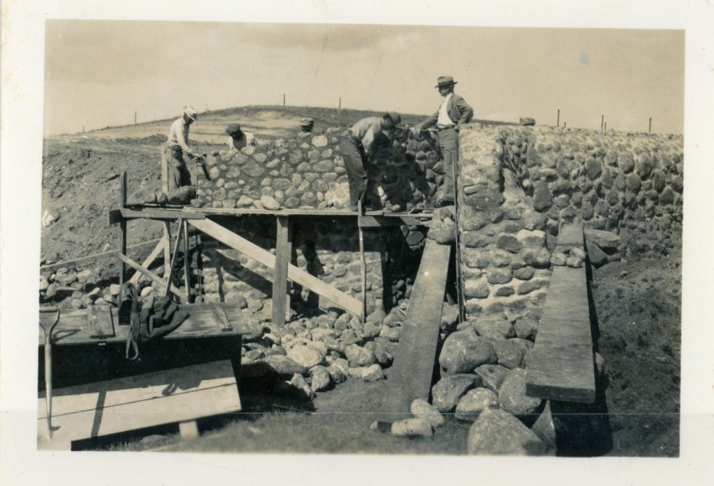 Stone masonry wall construction on site